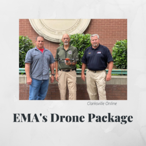 GIS Project Manager Doug Catellier stands with two members of the EMA. One EMA member holds a drone.